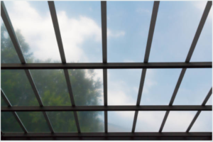 What are the benefits of using UV-resistant paint in roofing sheets?